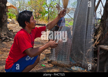 FISHERMAN fixing their nets in the 4 Thousand Islands Area (Si Phan Don) near DONE KHONE ISLAND - SOUTHERN, LAOS Stock Photo