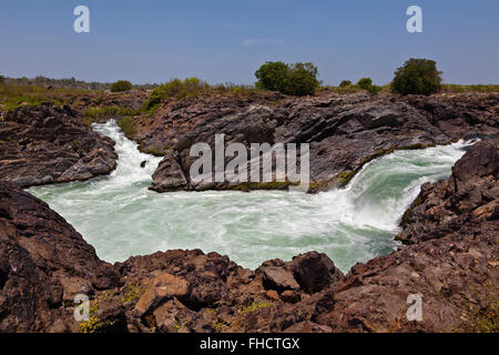 The TAM I DAENG WATERFALL is off the beaten track on the MEKONG RIVER in the 4 Thousand Islands Area (Si Phan Don) near DONE KHO Stock Photo