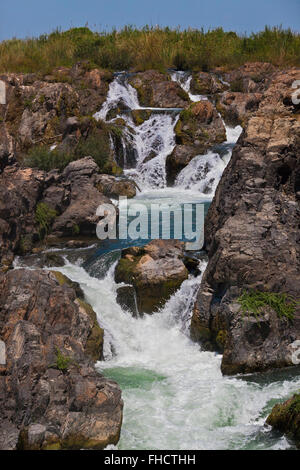 The TAM I DAENG WATERFALL is off the beaten track on the MEKONG RIVER in the 4 Thousand Islands Area (Si Phan Don) near DONE KHO Stock Photo