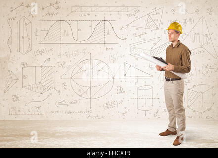 Handsome engineer calculating with hand drawn background Stock Photo