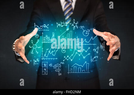 holding hand drawn business diagrams Stock Photo