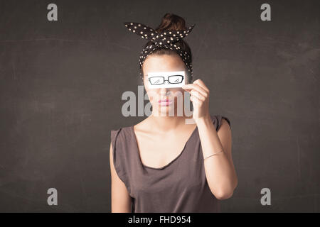 Happy girl looking with hand drawn paper eye glasses Stock Photo