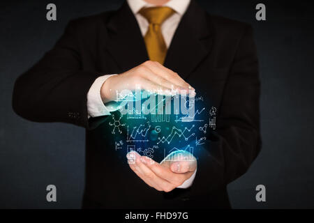 holding hand drawn business diagrams Stock Photo