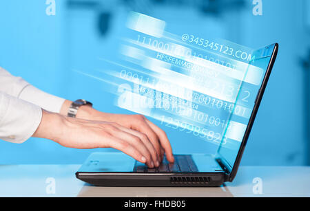 Close up of man typing on laptop computer Stock Photo