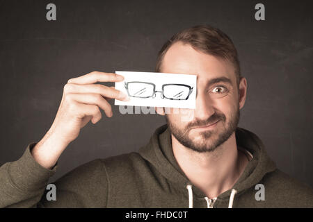 Happy guy looking with paper hand drawn eye glasses Stock Photo