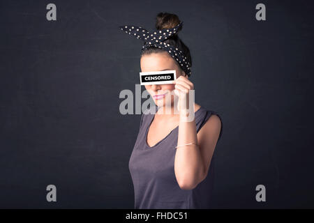 Pretty girl with censored paper sign Stock Photo