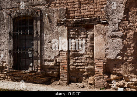 An old adobe wall and window in historic MINERAL DE POZOS which was once a large mining town - MEXICO Stock Photo