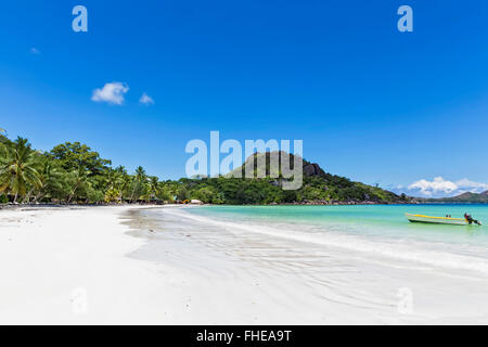Seychelles, Praslin, Anse Volbert, motorboat on beach Stock Photo