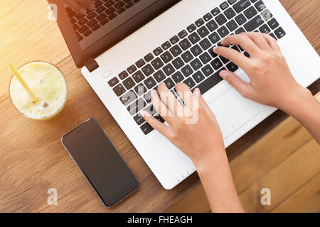 hand using laptop computer on top angle view Stock Photo