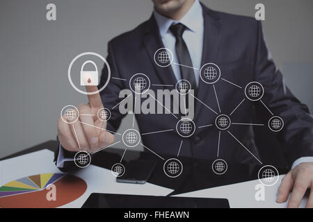 Businesswoman pressing security button on virtual screens, Stock Photo