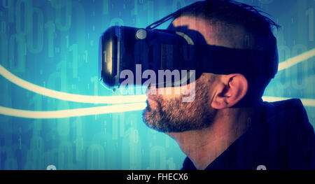 Binary code background man using virtual reality glasses Stock Photo