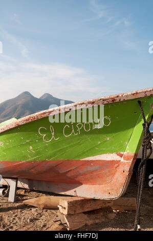 Detail of small fishing boat, El Cipollo with the volcanos of El Fraile n El Fraile Chico in the background, Cabo de Gata, Spain Stock Photo