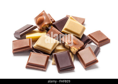 Several pieces of various kinds chocolate on pile isolated on white background. Stock Photo