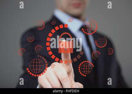 businessman pressing cyber security button on virtual screens Stock Photo