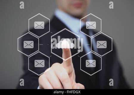 businessman using modern computer, pressing button on virtual screen. Stock Photo