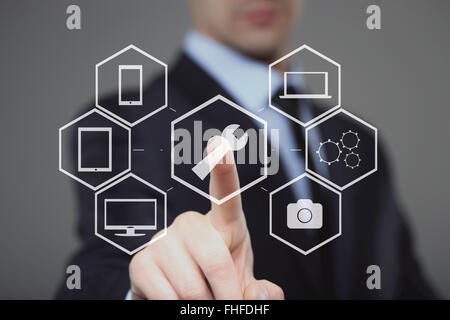 technology, internet and networking concept - businessman pressing technical support button on virtual screens Stock Photo