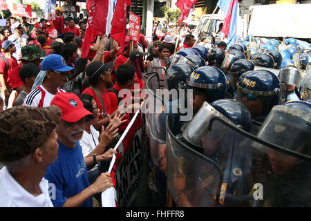 Philippines. 25th Feb, 2016. Protesters line up in front of the police line in Ortigas Avenue. Militant activists clashed with the police as they try to march towards EDSA Shrine in Quezon City. The protesters are calling for 'real'' democracy on the 30th anniversary of the EDSA People Power revolution with toppled president Ferdinand Marcos. © J Gerard Seguia/ZUMA Wire/Alamy Live News Stock Photo