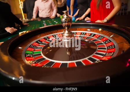green roulette table with collored chips ready to play Stock Photo
