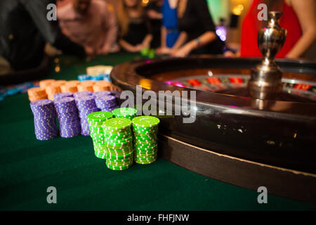 green roulette table with collored chips ready to play Stock Photo