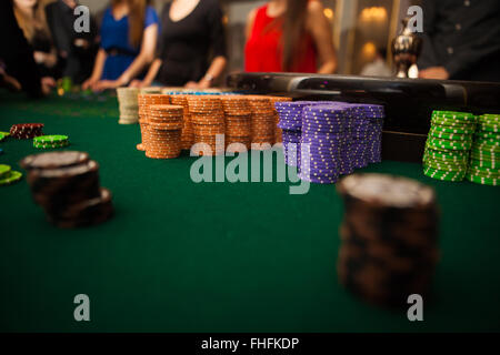 green roulette table with collored chips ready to play Stock Photo