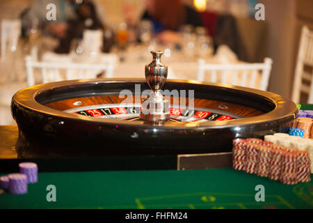 green roulette table with collored chips ready to play Stock Photo