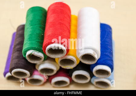 Sewing thread in various colors on a pile Stock Photo