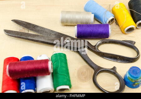 Sewing equipment chaos scattered on the table Stock Photo