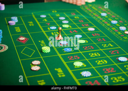 green roulette table with collored chips ready to play Stock Photo