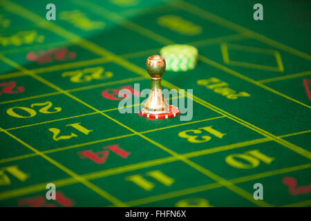 green roulette table with collored chips ready to play Stock Photo