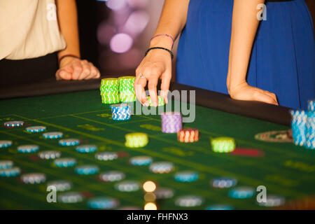 green roulette table with collored chips ready to play Stock Photo