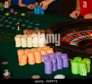 green roulette table with collored chips ready to play Stock Photo