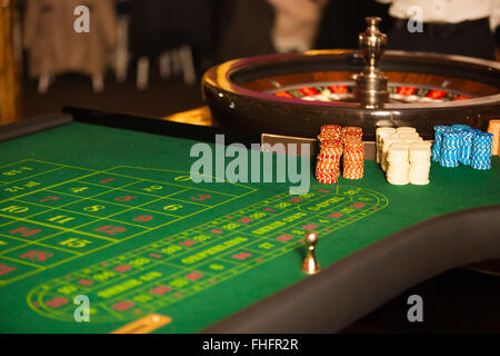 green roulette table with collored chips ready to play Stock Photo