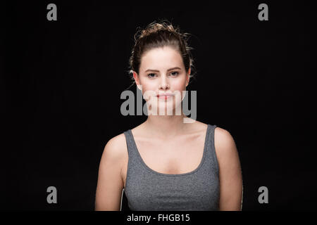 young woman with cigarette, smoking concept on black background Stock Photo