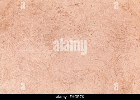 Concrete wall with pink decorative stucco pattern, background photo texture Stock Photo