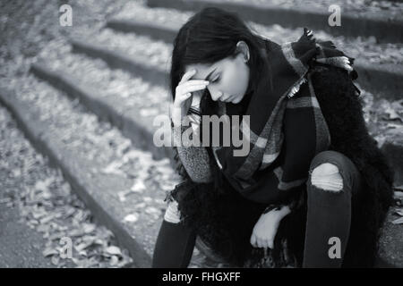 Sad teen girl outdoor feeling depressed Stock Photo