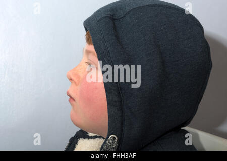 10-year old boy wearing a hooded top Stock Photo