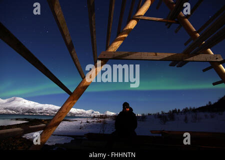 A paganic scene under aurora borealis in Northern Norway Stock Photo