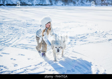 Cute girl playing with dog Stock Photo