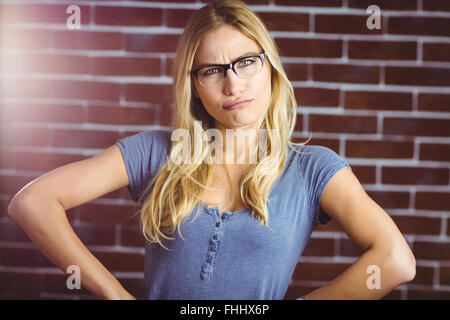 Woman posing with hand on hips Stock Photo