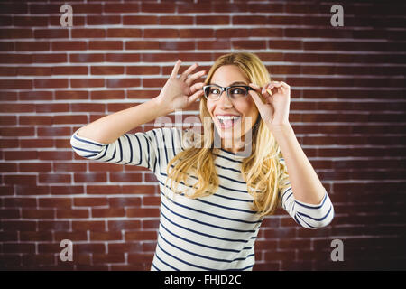 Blonde woman posing with glasses Stock Photo