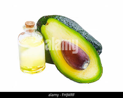 Avocado oil bottle with avocado fruit isolated on white Stock Photo