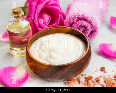 Spa roses body-lotion and cream, bath oil and sea salt, cotton towel Stock Photo
