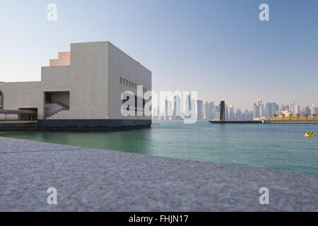Museum of Islamic Art, Doha, Qatar. View from the walkway around the park towards Serra Seven and West Bay.