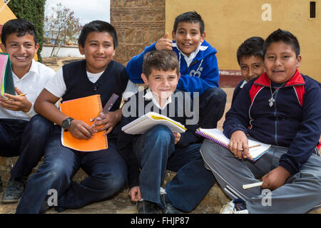 Santa Ana Zegache, Oaxaca, Mexico - Sixth grade school boys with their school work. Stock Photo