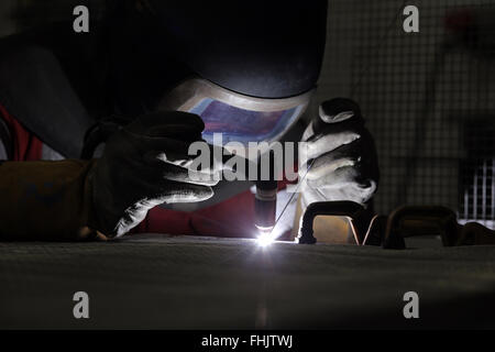 A welder welding aluminium at a factory in Stockton-On-Tees, UK. Stock Photo