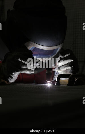 A welder welding aluminium at a factory in Stockton-On-Tees, UK. Stock Photo