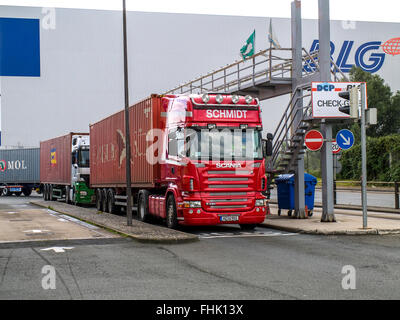Trucks with 40' containers lined up at the Check-in Gate in the Port of Bremen. Stock Photo
