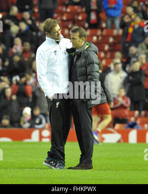 Liverpool, UK. 25th February, 2016. Augsburg's head coach Markus Weinzierl (r) talks to Liverpool's head coach Juergen Klopp prior to the UEFA Europa League round of 32, second leg soccer match between Liverpool FC and FC Augsburg in Anfield, Liverpool, England, on 25 February 2016. Credit:  dpa picture alliance/Alamy Live News Stock Photo