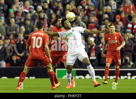 Liverpool, UK. 25th February, 2016. Augsburg's Caiuby (r) vies for the ball with Liverpool's Emre Can during the UEFA Europa League round of 32, second leg soccer match between Liverpool FC and FC Augsburg in Anfield, Liverpool, England, on 25 February 2016. Credit:  dpa picture alliance/Alamy Live News Stock Photo