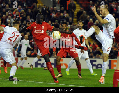 Liverpool, UK. 25th February, 2016. Augsburg's Ragnar Klavan (r) vies for the ball with Liverpool's Mamadou Sakho during the UEFA Europa League round of 32, second leg soccer match between Liverpool FC and FC Augsburg in Anfield, Liverpool, England, on 25 February 2016. Credit:  dpa picture alliance/Alamy Live News Stock Photo